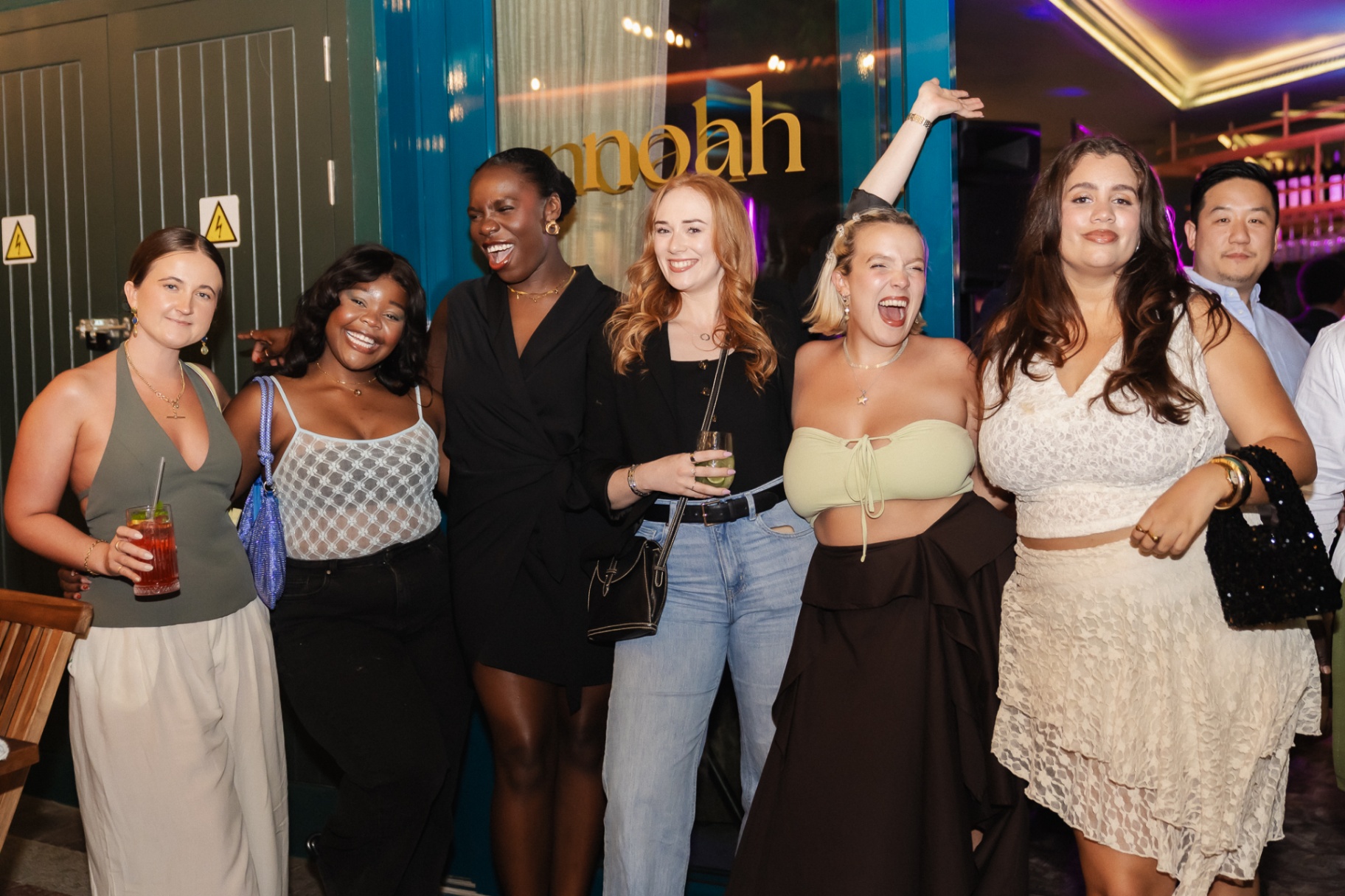 Group of friends celebrating outside Noah Cape Town on a First Thursday evening