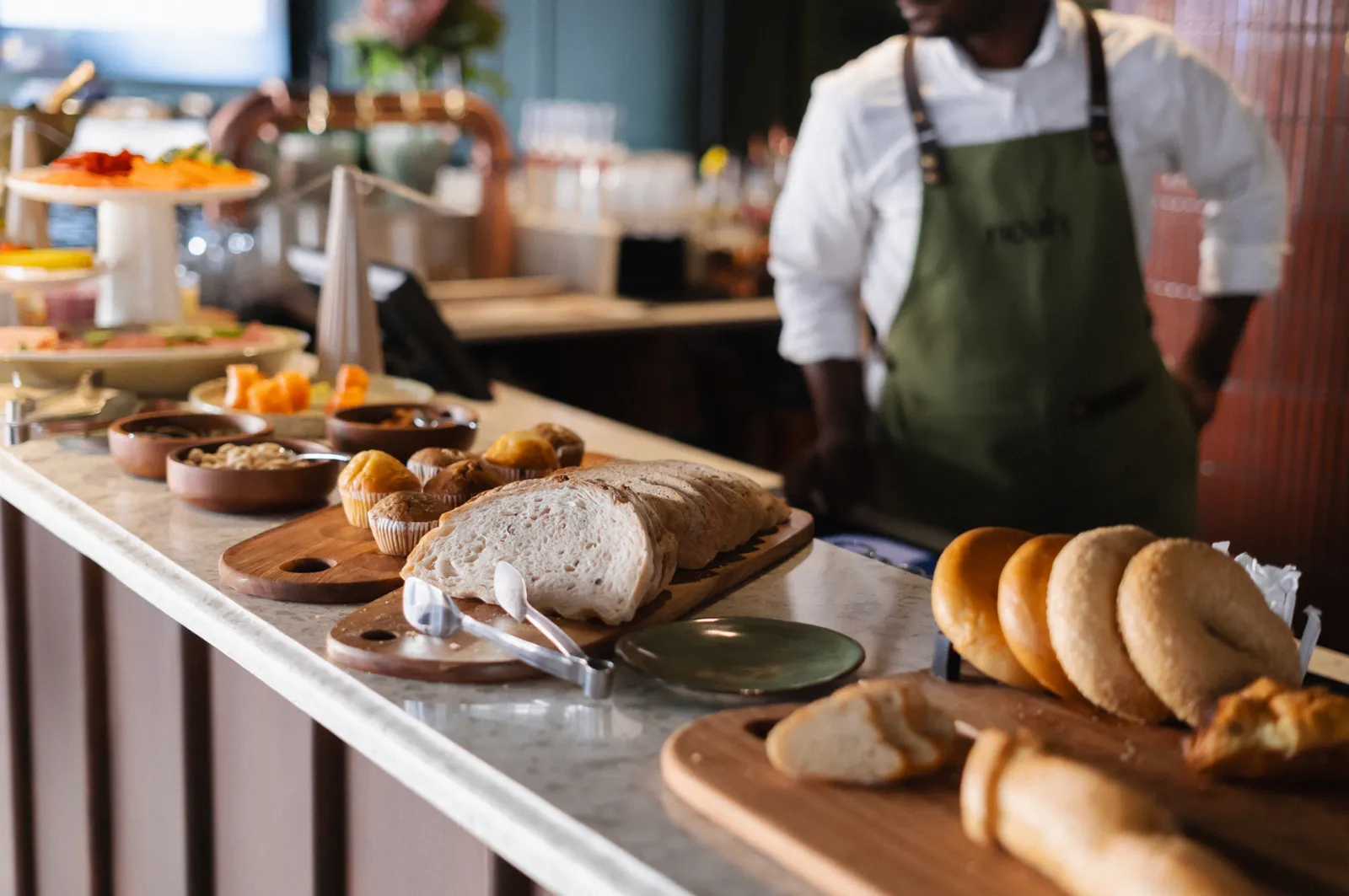 Bakery counter at Noah with fresh sourdough loaves and morning pastries