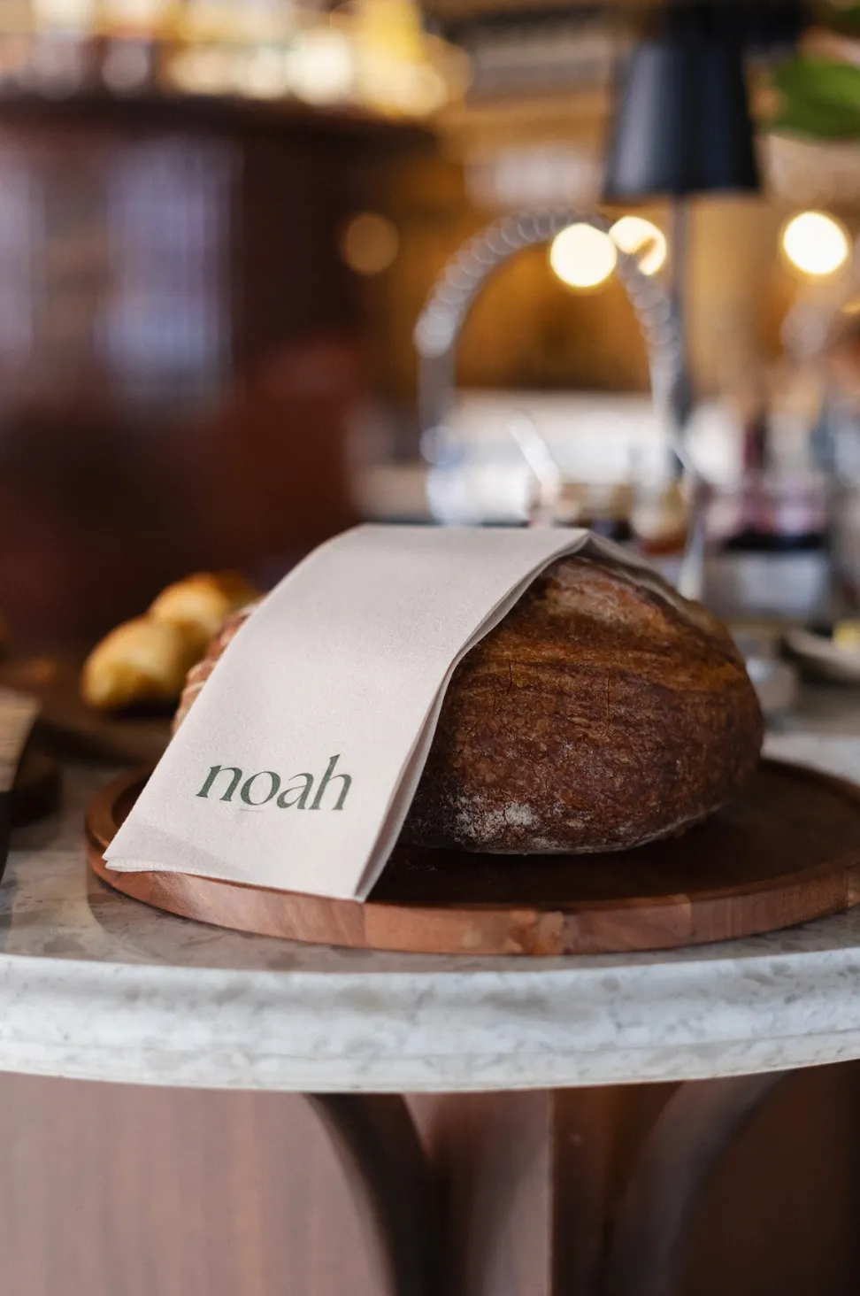 Rustic sourdough loaf baked daily at Noah Cape Town
