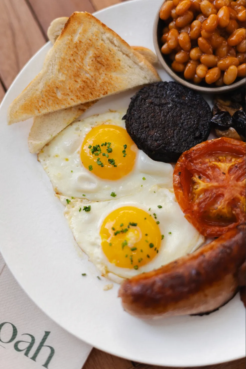 Close-up of a Noah Cape Town breakfast plate with eggs and sourdough toast