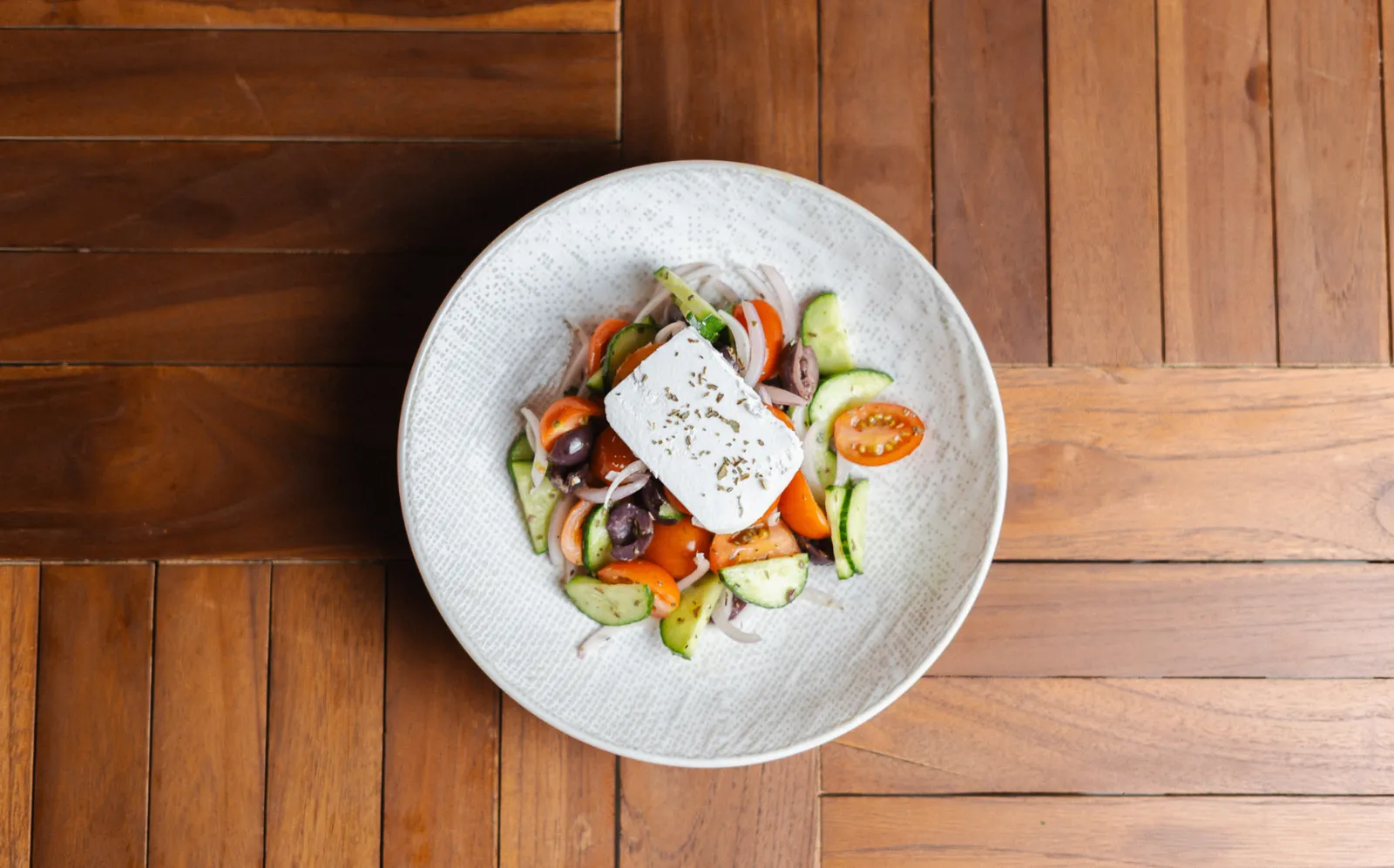 Traditional Greek salad with feta, olives, cucumber and oregano