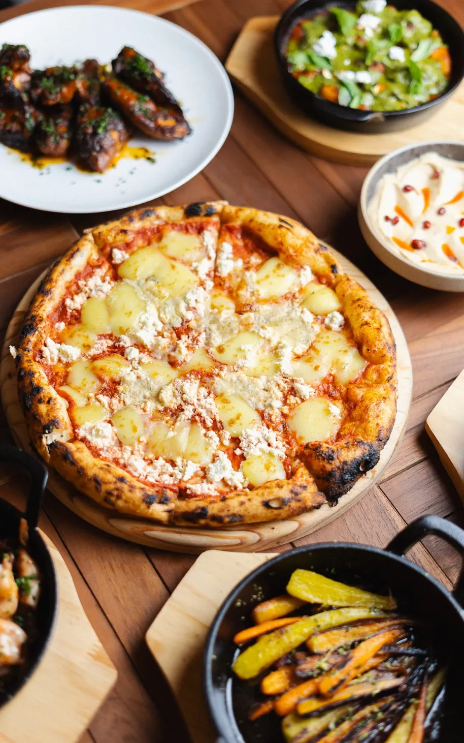 Wood-fired potato and Italian sausage pizza with rosemary