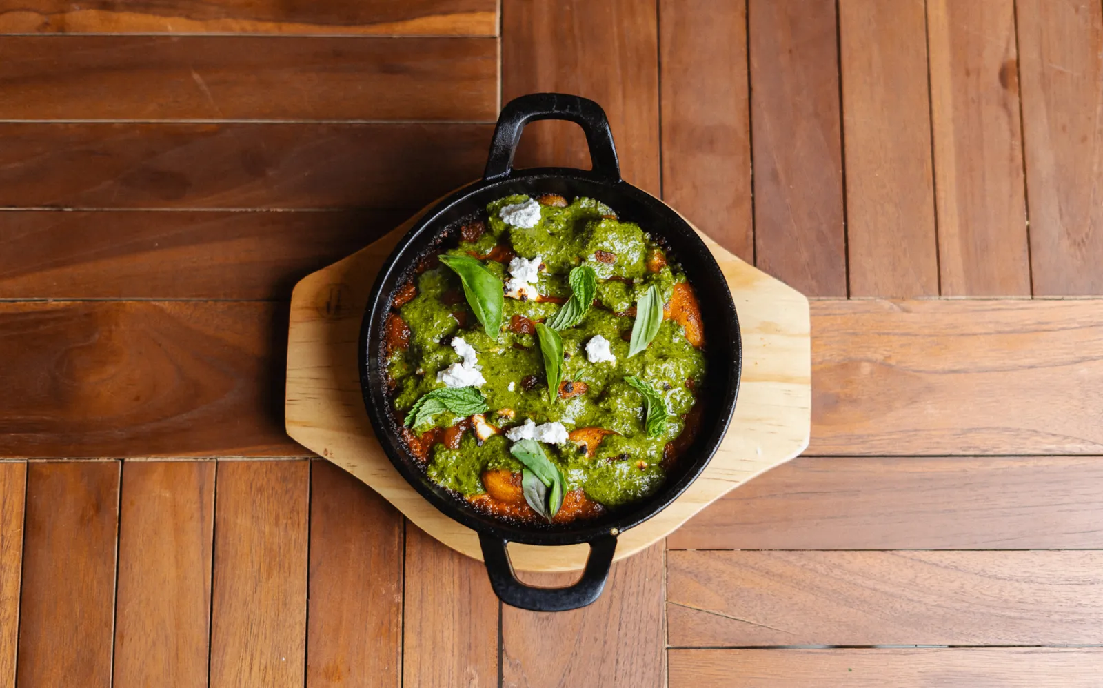 Wood-fired red pepper gnocchi in a cast-iron pan at Noah Cape Town