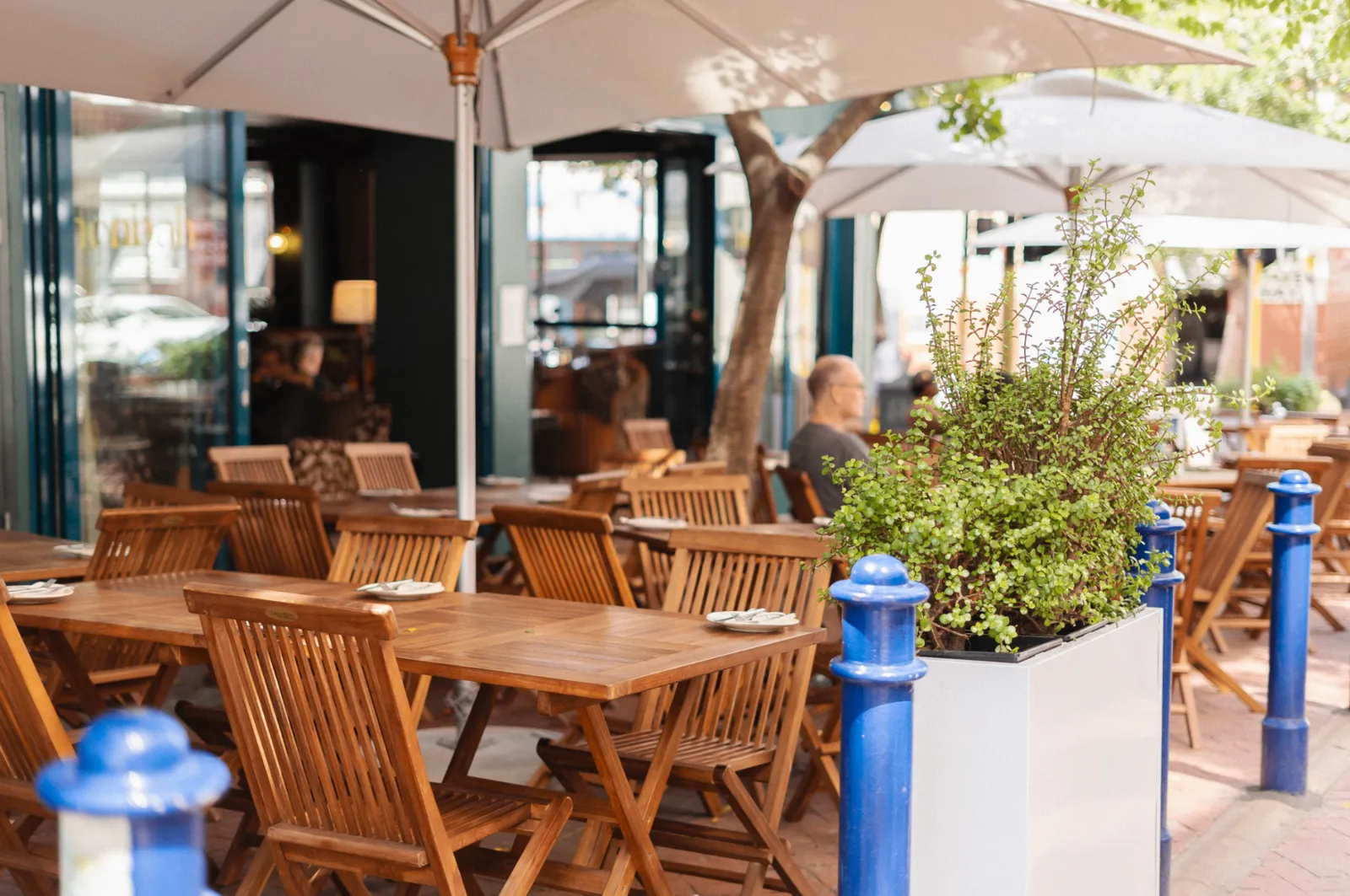 Noah Cape Town outdoor terrace on Loop Street with cream umbrellas and pavement seating