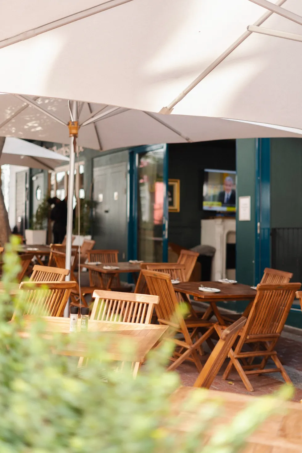 Shaded sidewalk seating outside Noah Cape Town in the CBD