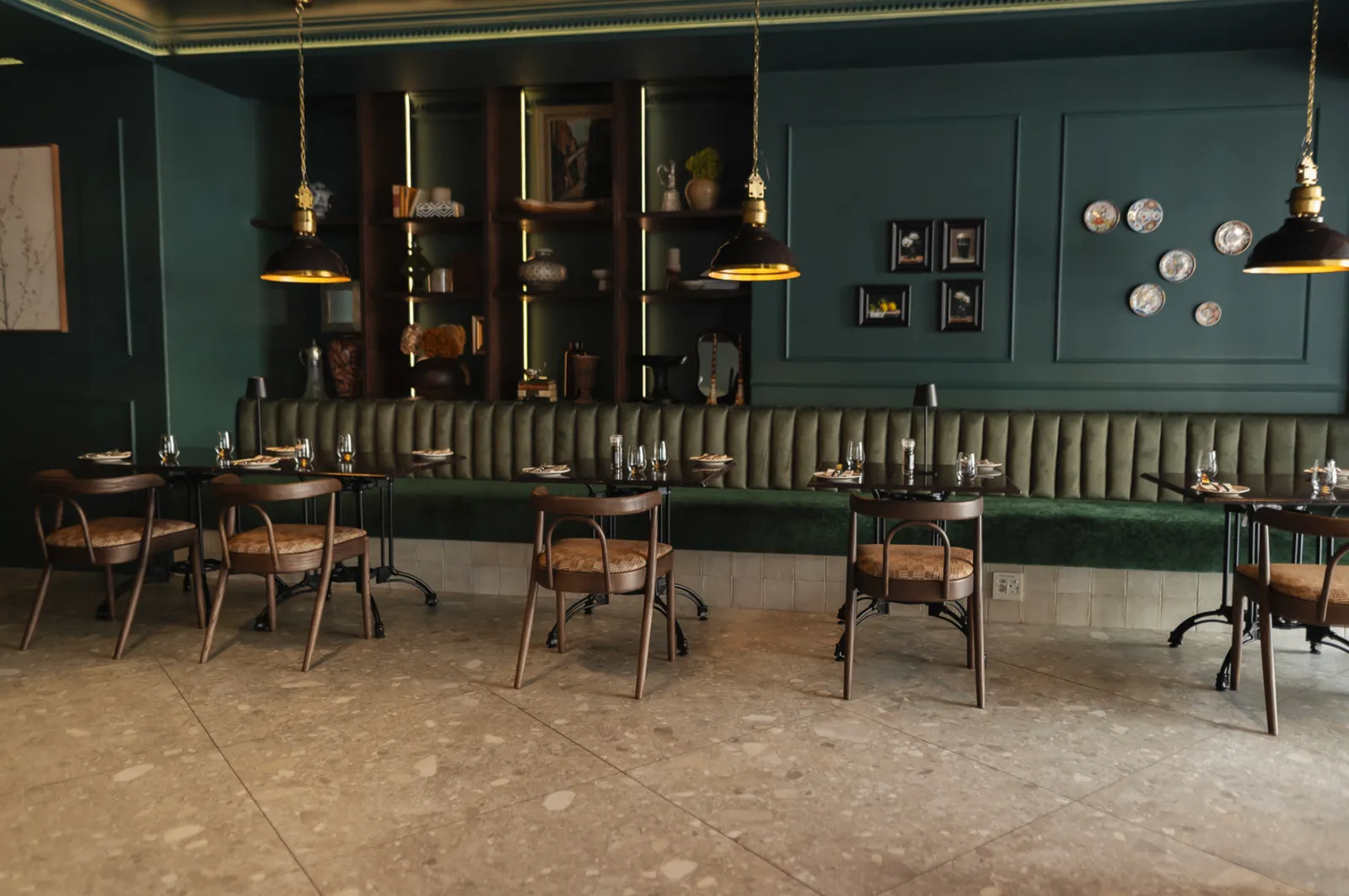 Noah Cape Town intimate dining nook with green banquette and ambient lighting